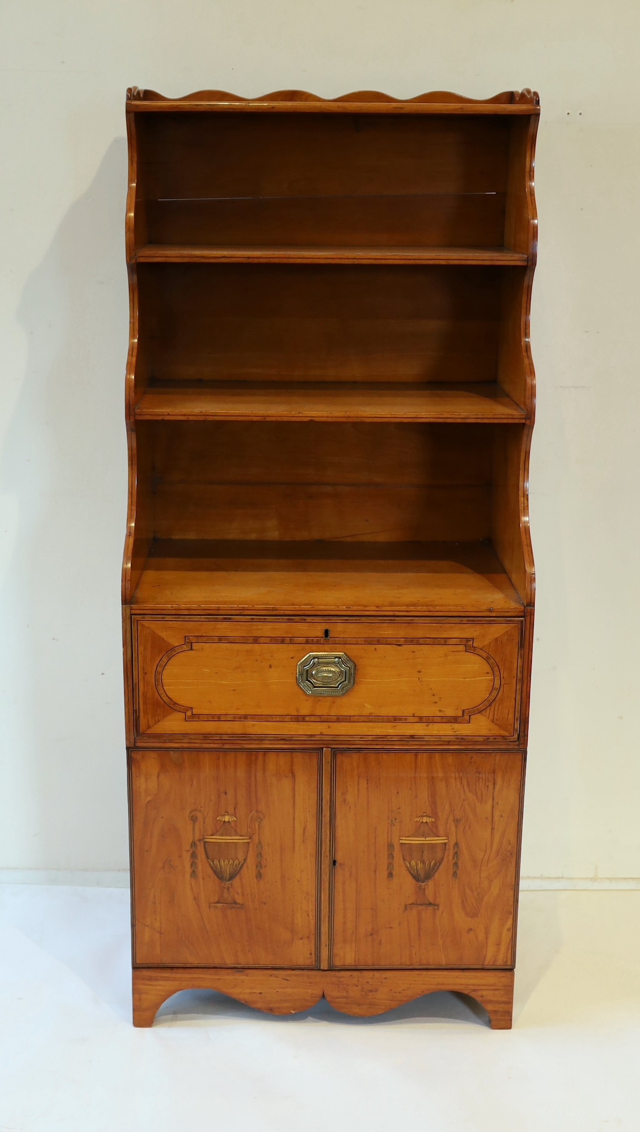 A George III Sheraton style inlaid satinwood waterfall bookcase, W.56cm D.37cm H.135cm